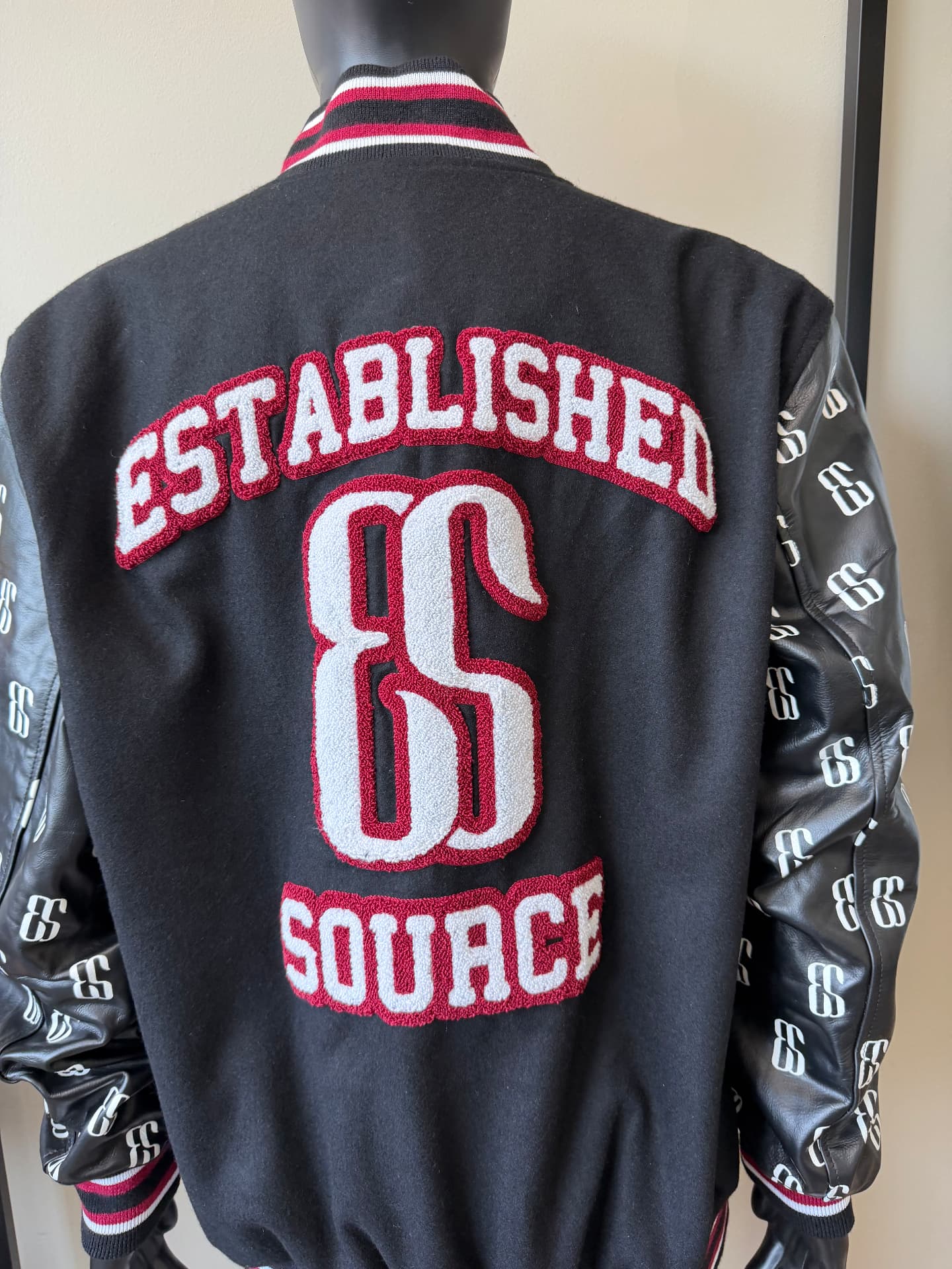Custom varsity jacket with chenille patches made by With Ease Studio in Detroit